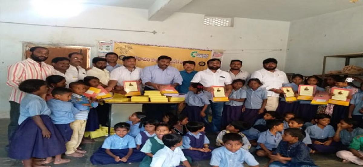 Golluri distributes books to students