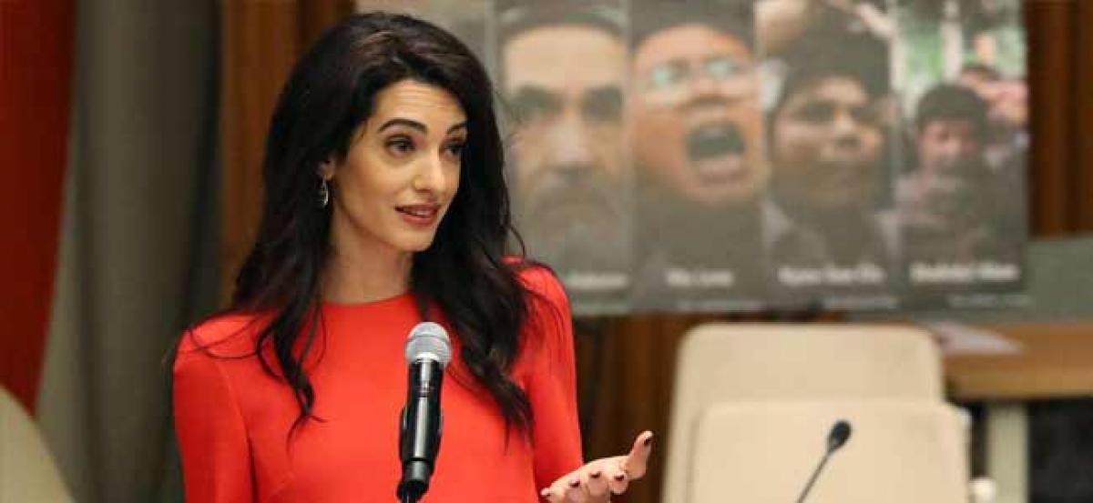 Amal Clooney calls on Myanmars Aung Suu Kyi to pardon Reuters reporters