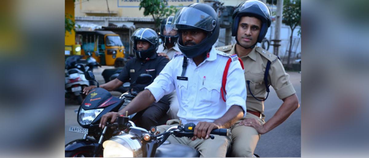 SP Vishal Gunni pillion rides to assess traffic troubles in Kakinada