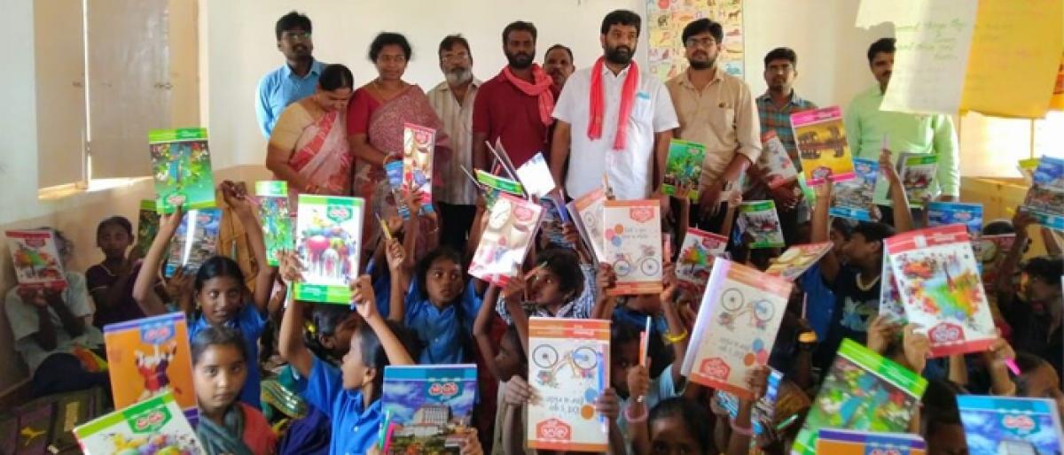 Notebooks distributed to schoolchildren in Eluru