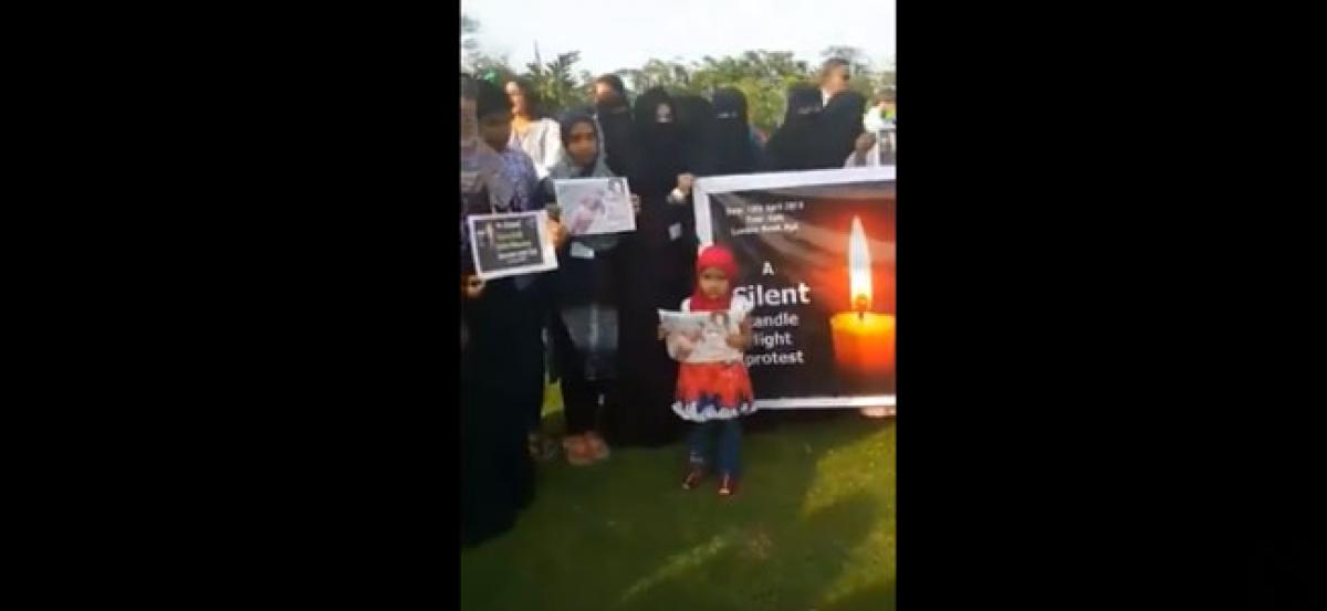 Silent Standing candle light protest in hyderabad Justice for Asifa