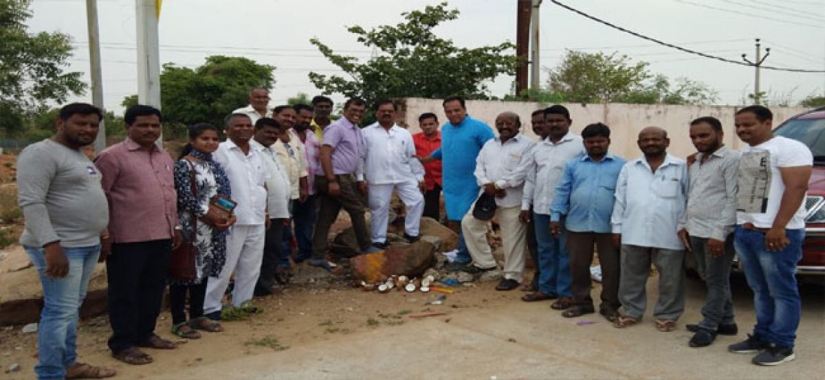 Stone laid for platform in burial ground