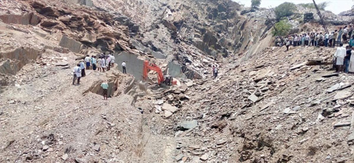 2 killed as a portion of quarry caves in on them