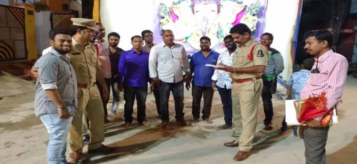 Police inspect Ganesh pandals