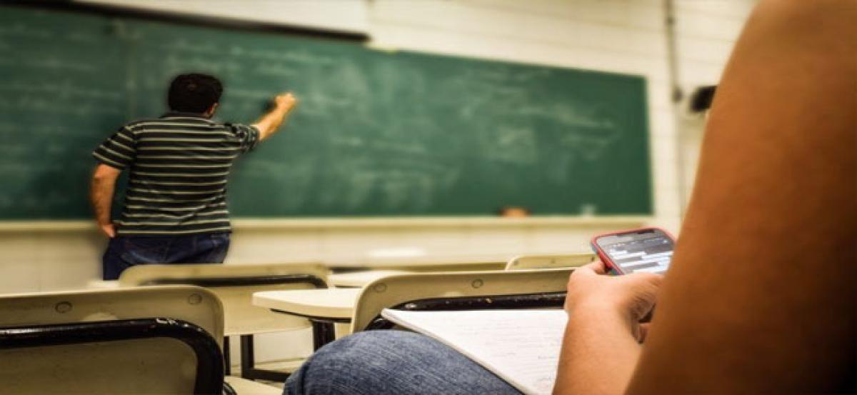 Checking phones in lectures may cost students grades