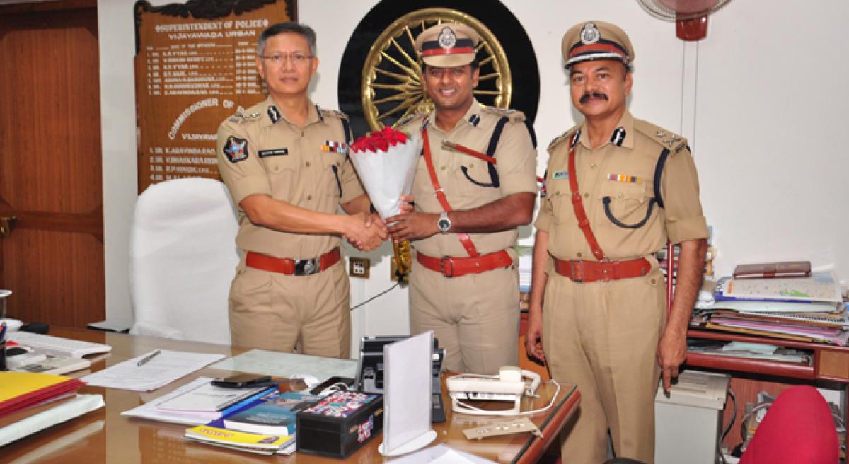 Commissioner of Police greets two cops on promotion