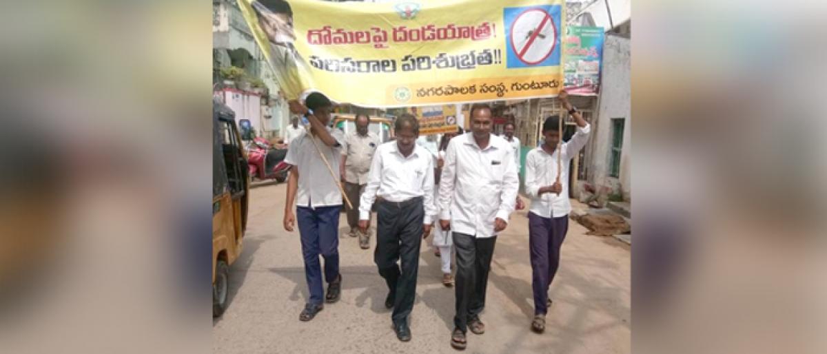 Domalapai Dandayatra to check spread of diseases awareness programme by GMC officials in Guntur