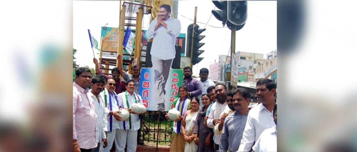 YSRCP leaders washed YS Jagan’s cutout with Godavari water