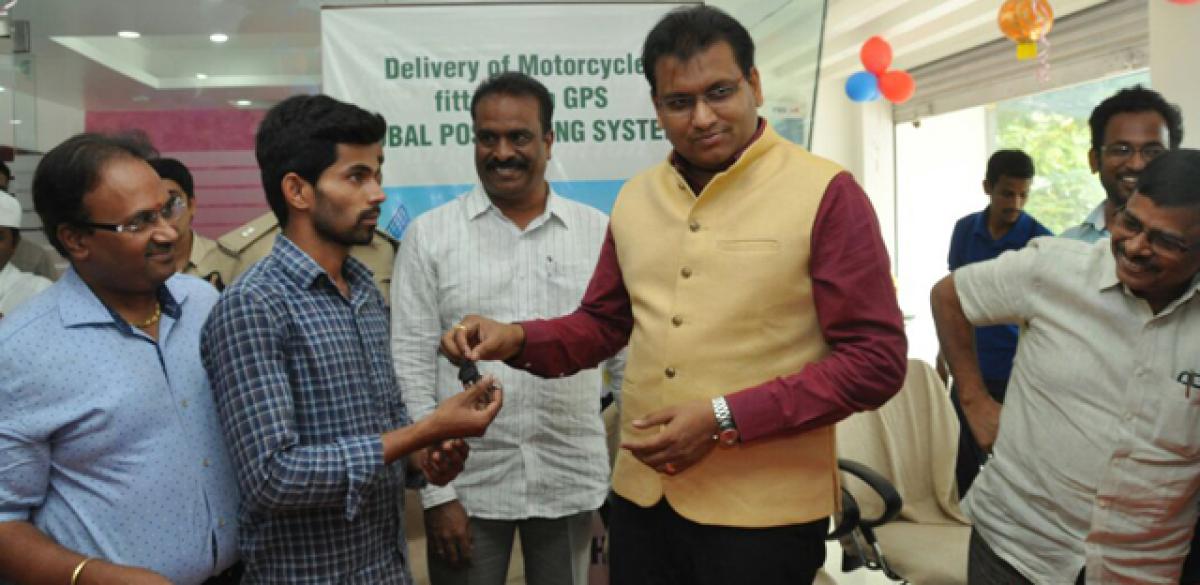 Collector hands over Global Positioning System-fitted bike