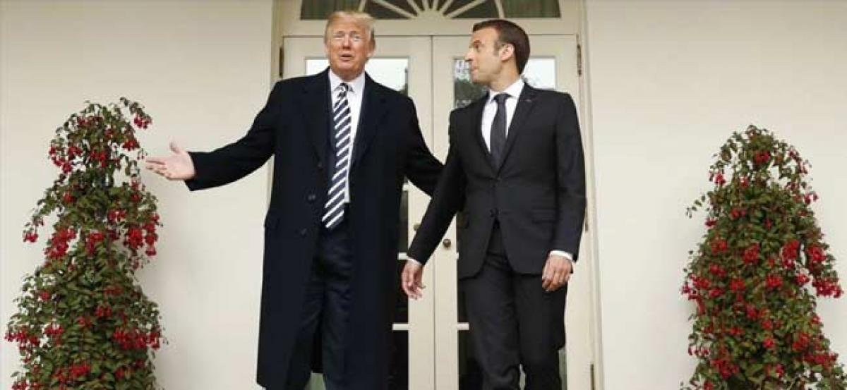 Macron rules out trade war with US over Iran deal as firms head for exit