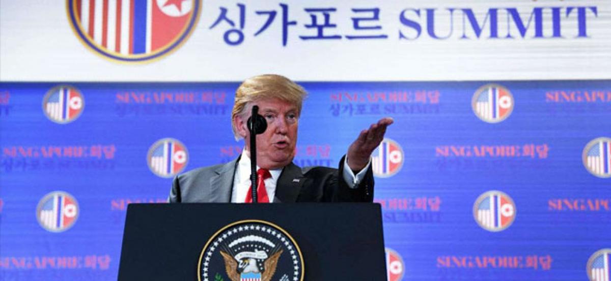 Trump says Kim made unwavering commitment to denuclearise, but sanctions on North Korea will remain for now