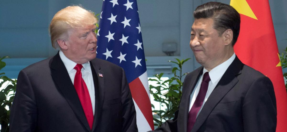 Trade war heats up as punishing US tariffs on Chinese imports take effect