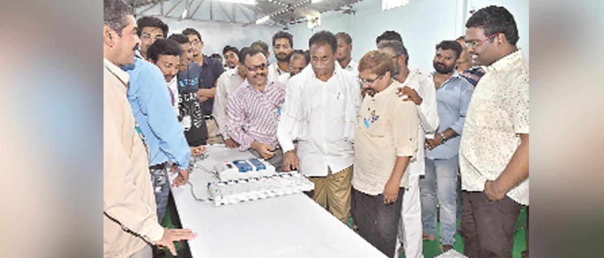 Collector Rajiv Gandhi Hanumanthu checks new EVMs