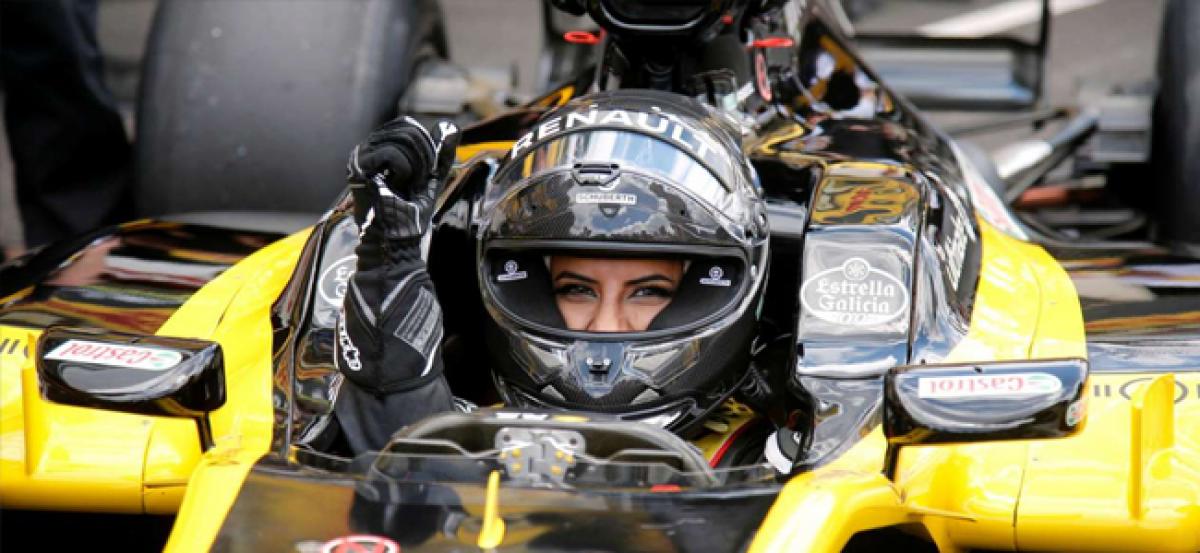 Watch: Thousands of fans cheer as Saudi woman drives F1 car on historic day