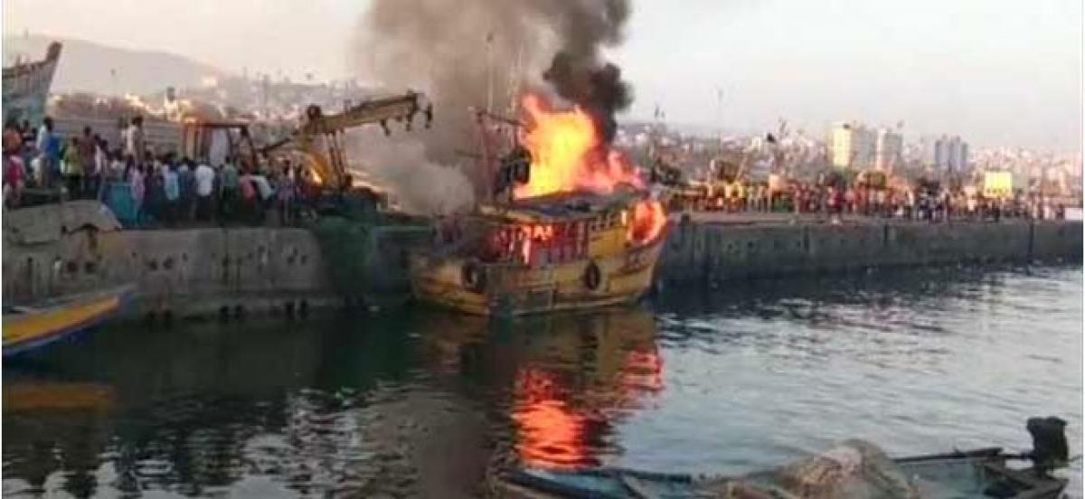 Fishing boat catches fire at Kakinada harbour