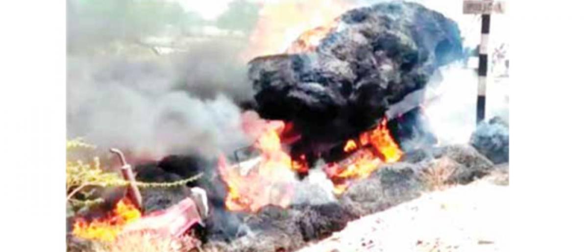 Haystack-laden tractor reduced to ashes