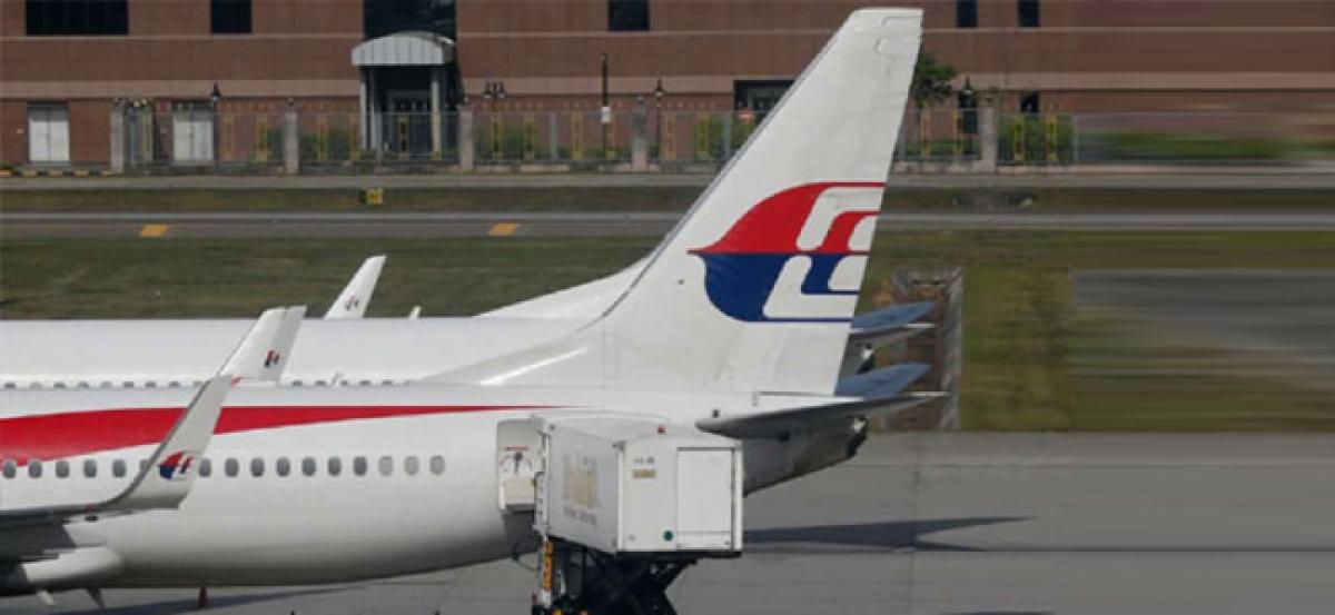 Flight MH370: Families of people aboard hope for answers from official report