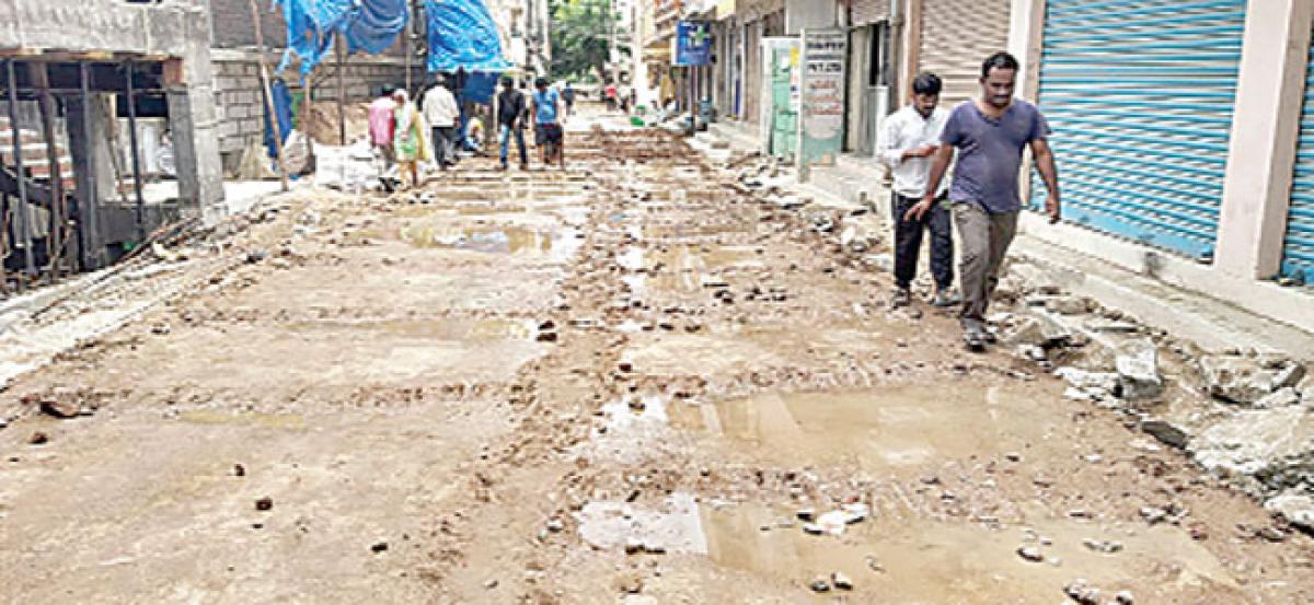 GHMC officials inspect CC road works