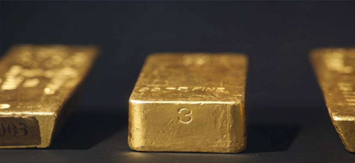Gold gains as metals rally sparks inflation concerns