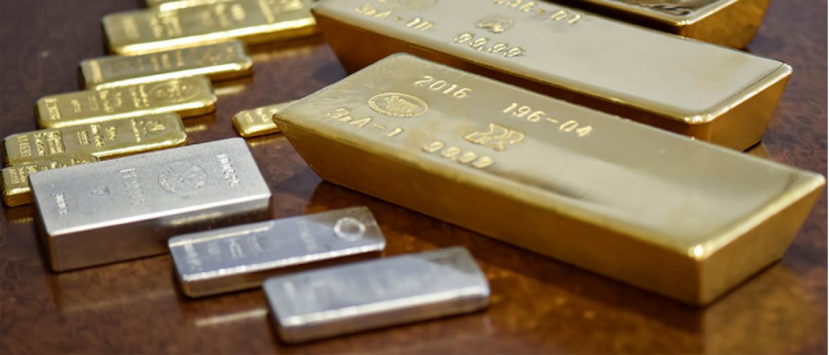 Gold prices drop; Silver rates pick-up