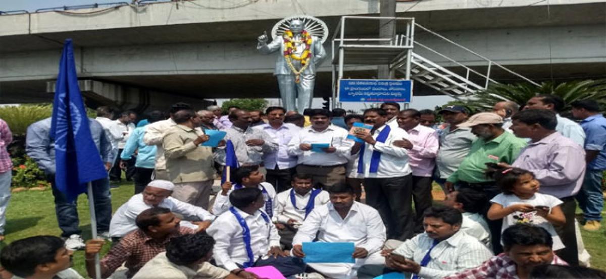 Dalits protest at Ambedkar statue