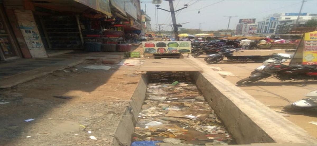 Residents endure stench from open drains