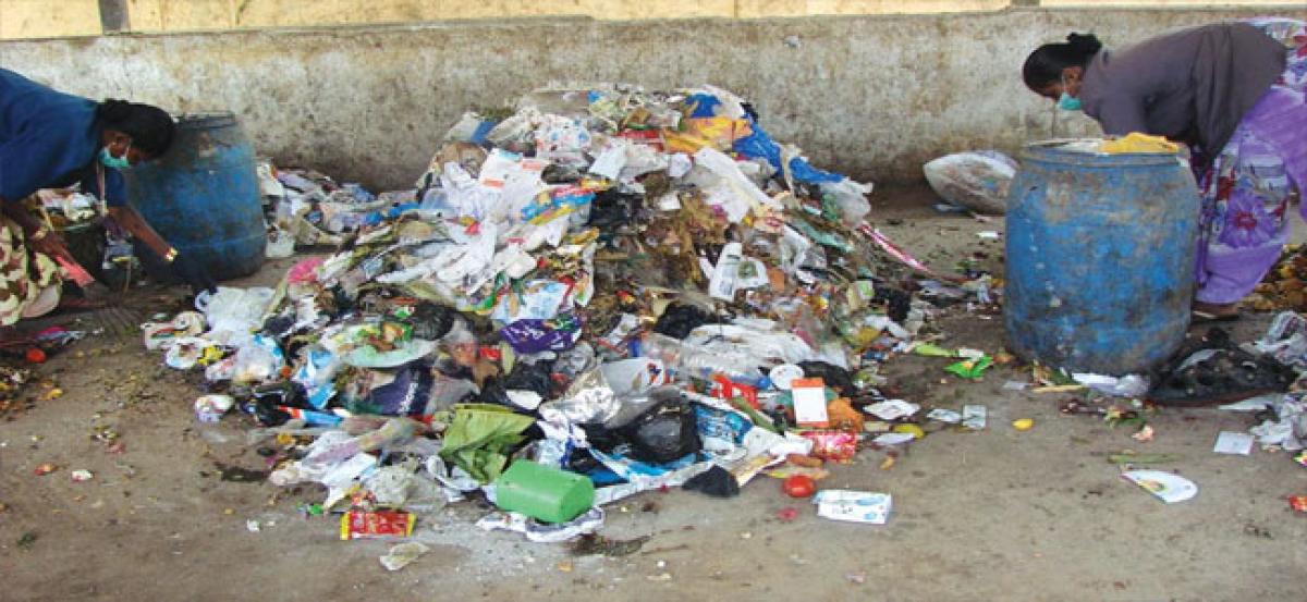 Corporator inspects piled up garbage