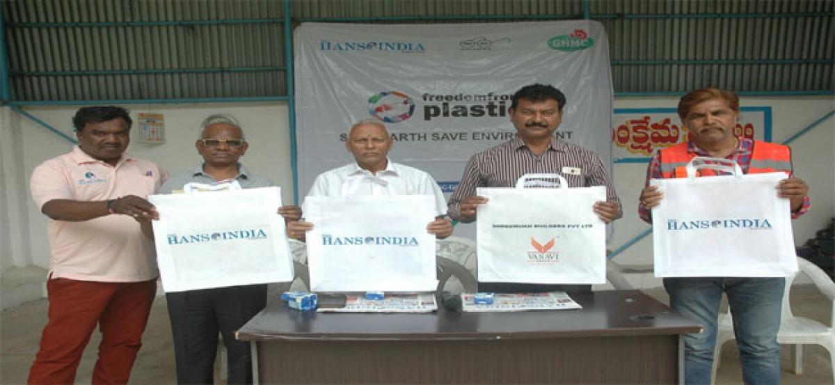 Hans, GHMC distribute cloth bags at Erragadda