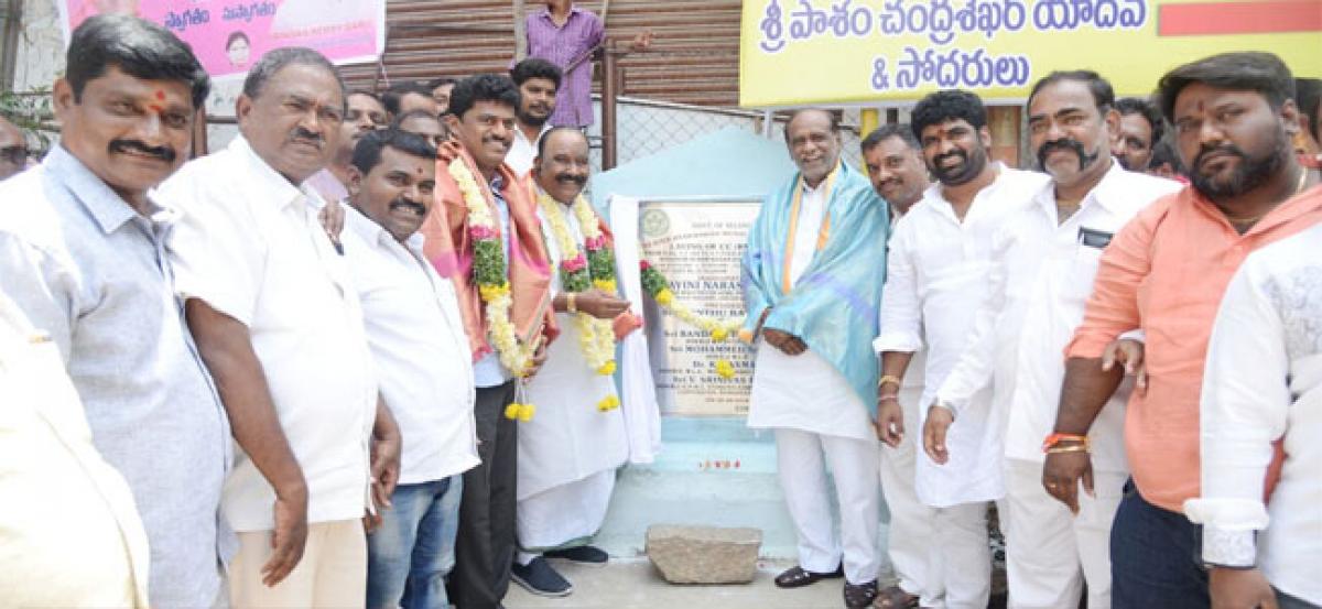 Naini Narsimha Reddy lays stone for CC road, power bore works