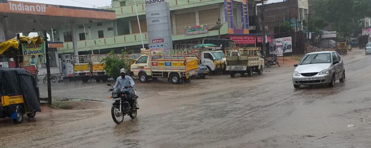 Farmers cheer heavy rains, get busy tilling