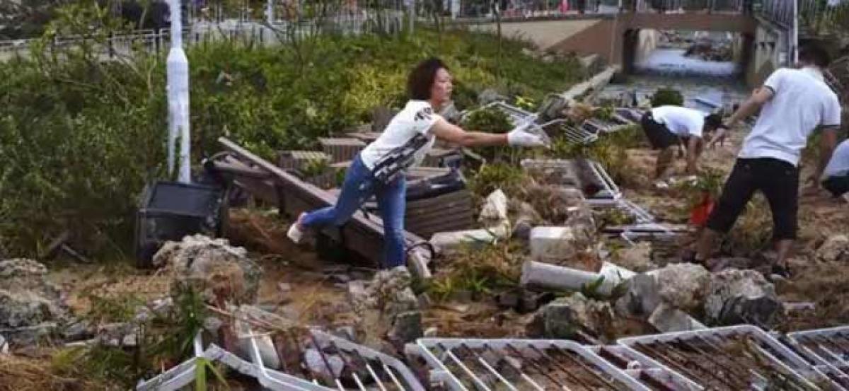 Hong Kong begins massive clean-up after Typhoon Mangkhut chaos