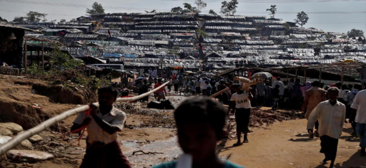 Myanmar finds more bodies in mass grave; U.N. seeks rapid aid increase