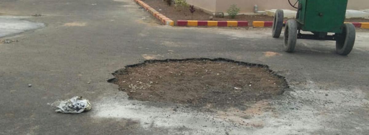 Potholes appear at RTC complex after its opening