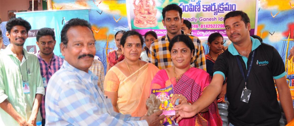 Mayor Pantham Rajani Sesha Sai distributes clay idols in Rajamahendravaram