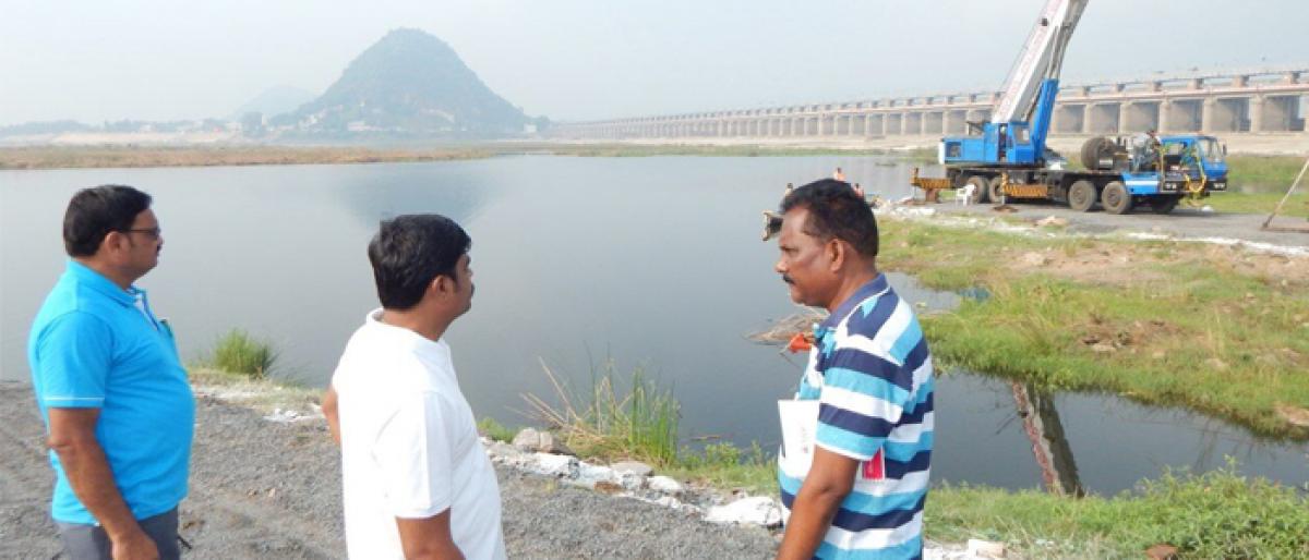 Civic chief J Nivas inspects idol immersion site at Prakasam barrage in Vijayawada