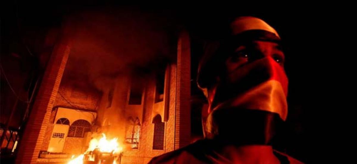 Unrest intensifies in Iraq as protesters storm and burn down Iranian consulate