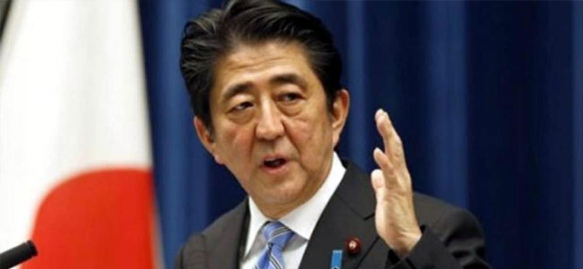 Japan PM Shinzo Abe to meet stranded evacuees in flood disaster zone
