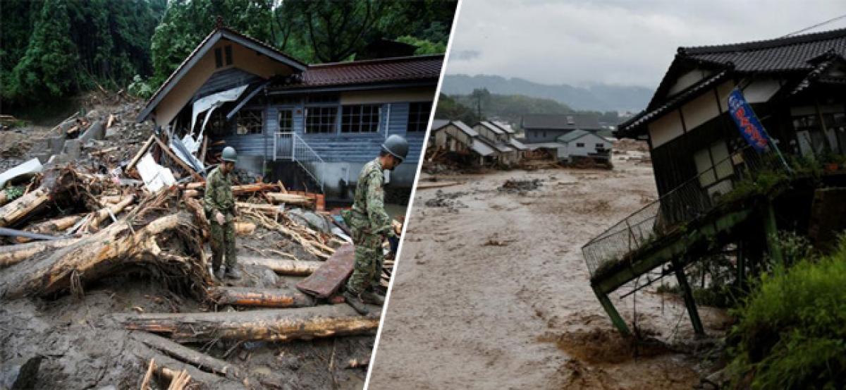 Japan rescuers dig through rubble as more rain falls, at least 11 dead