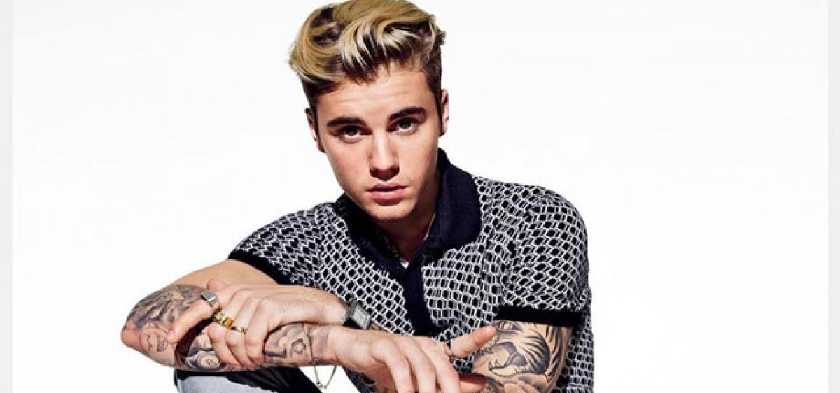 Bieber fined for using phone while driving