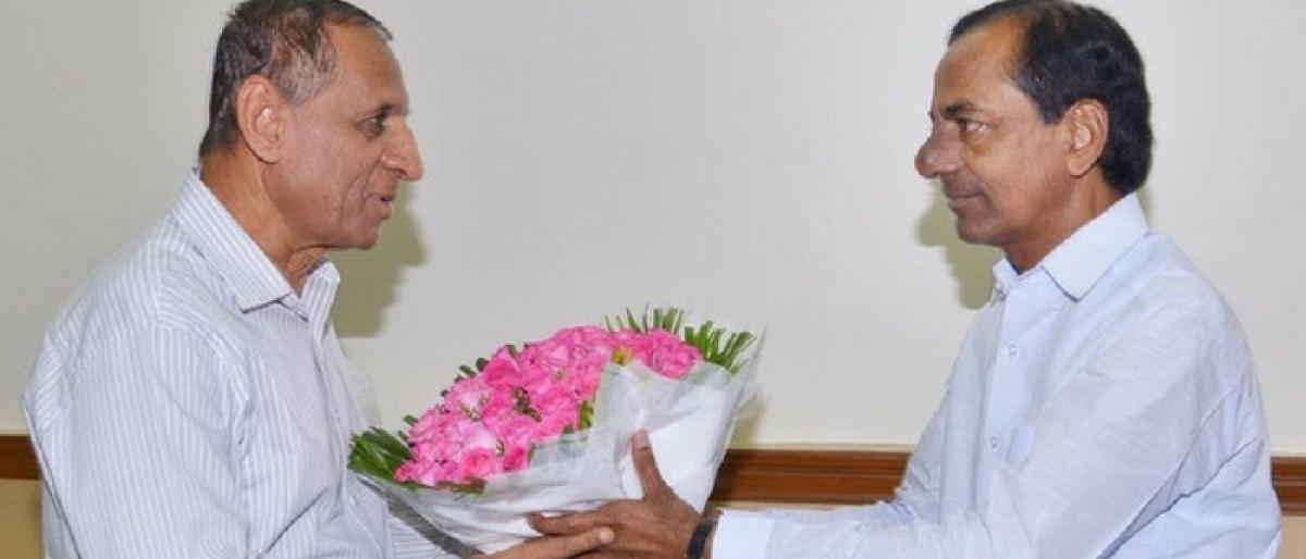 KCR meets Governor, discusses GST