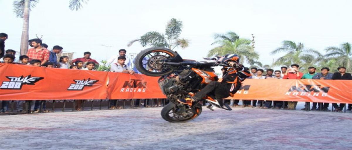 Professional stunt riders demonstrate tricks