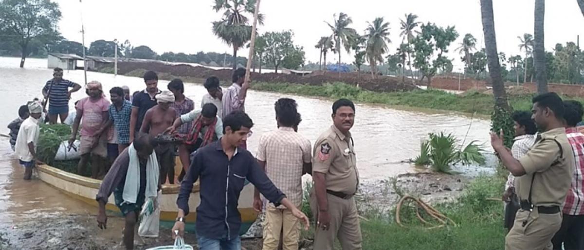 Cops engaged in relief operations in Kakinada