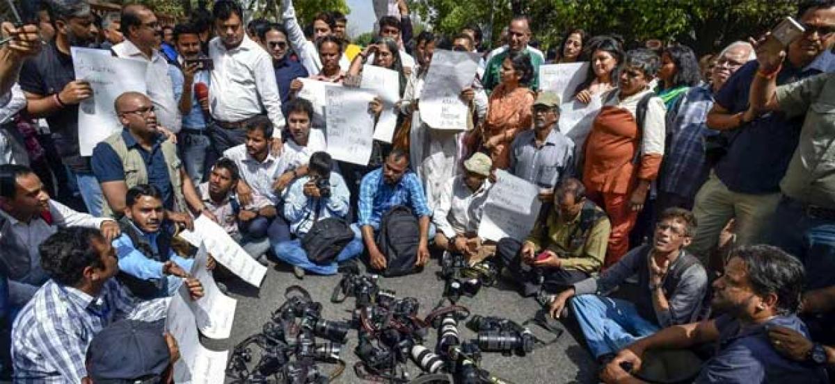 Two RSS workers arrested for attack on photojournalist in Kerala