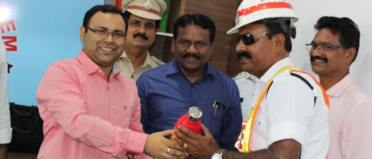 Water bottles distributed to traffic police in Kothagudem