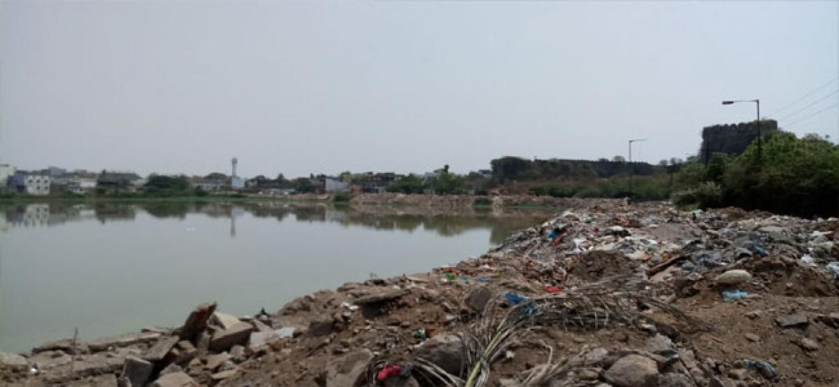 GHMC dumping construction debris in Talab Lake