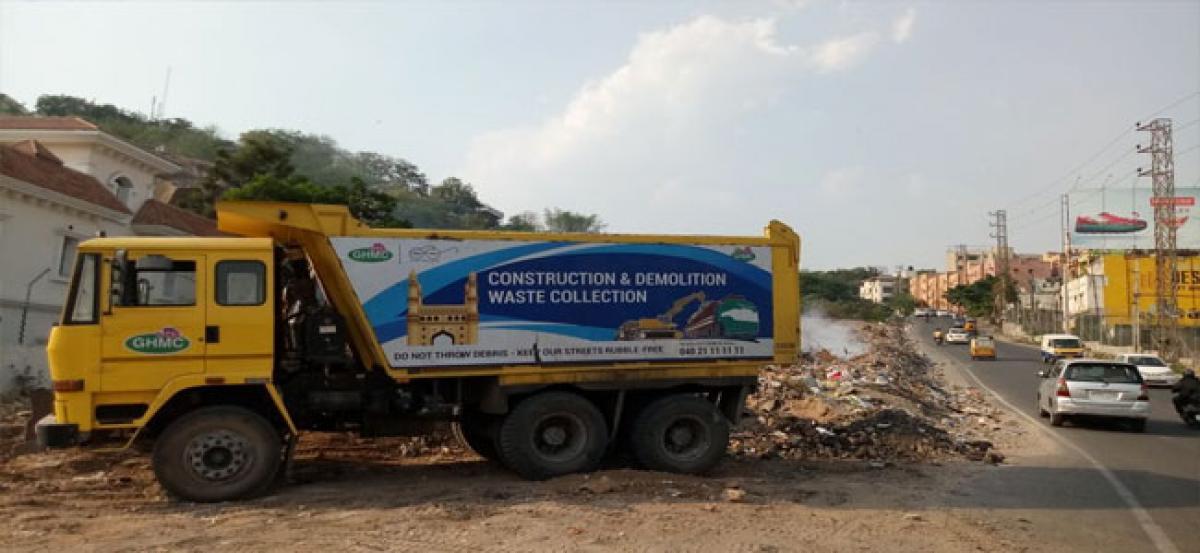 GHMC takes up task of clearing construction debris along roadside