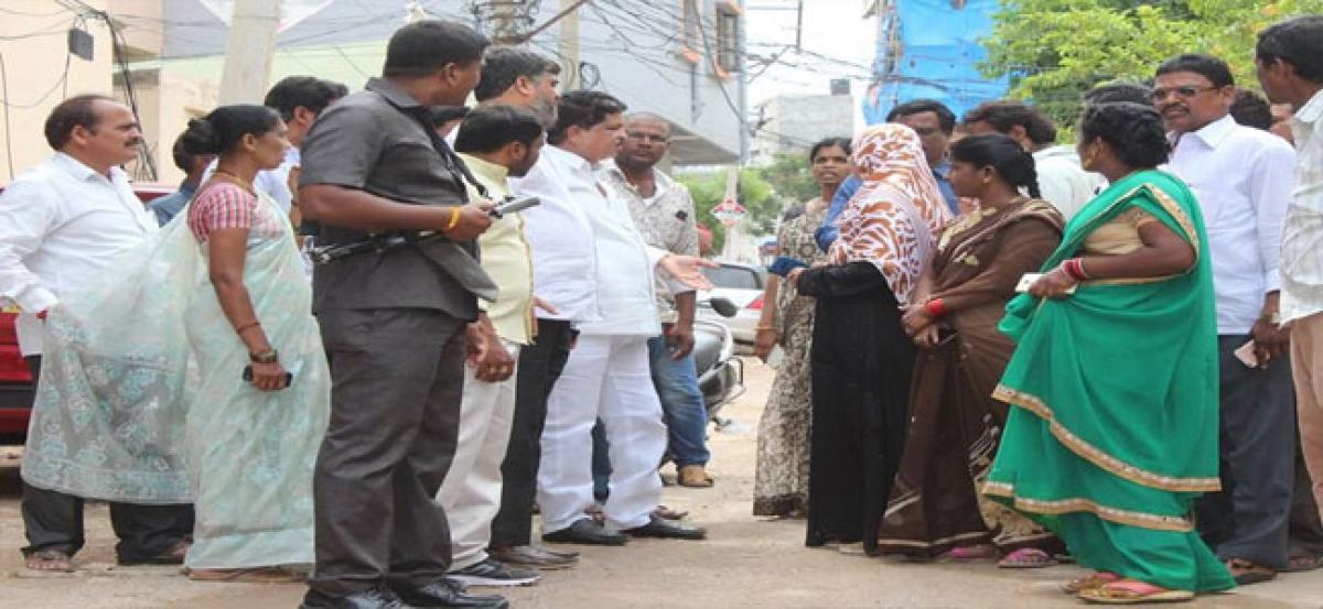 MLA inspects damaged road