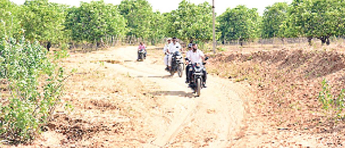 Mancherial Collector rides bike to reach remote villages