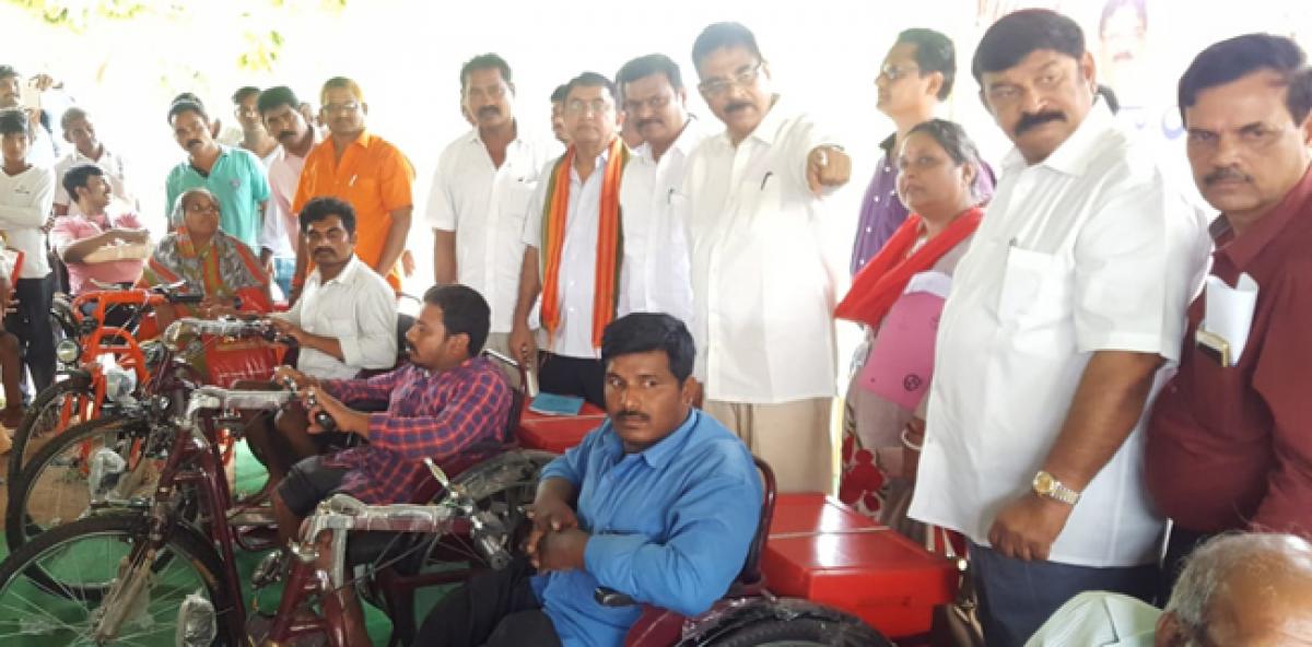 Haribabu distributes tri-cycles