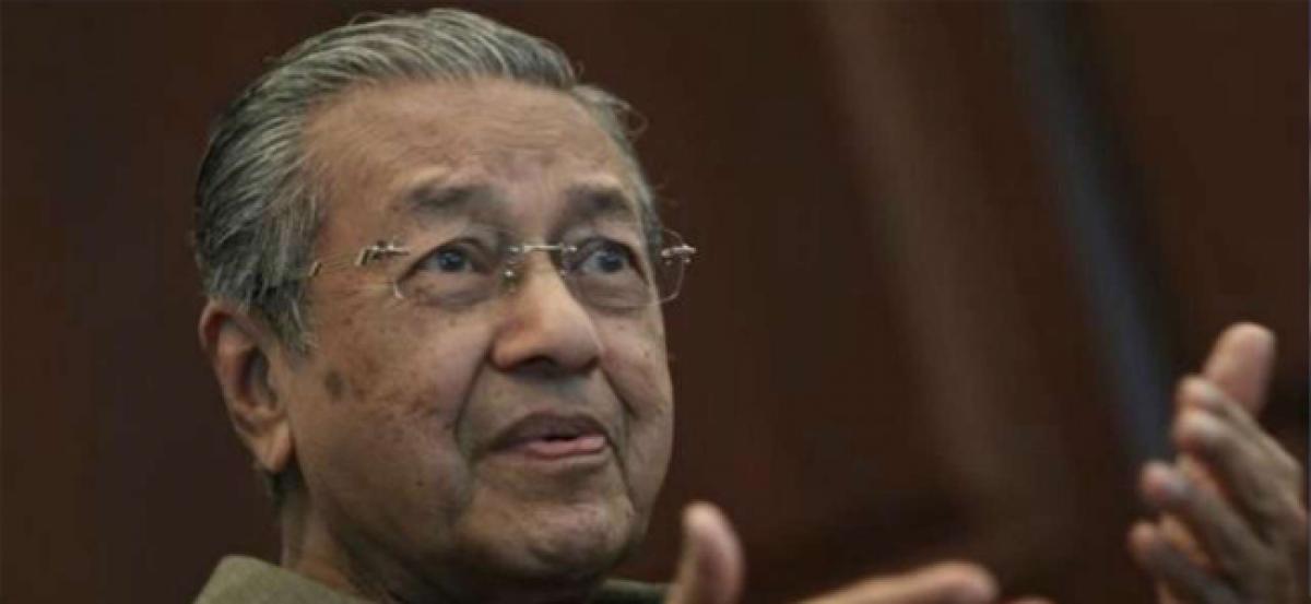Malaysias Mahathir says will raise unfair contracts in visit to China